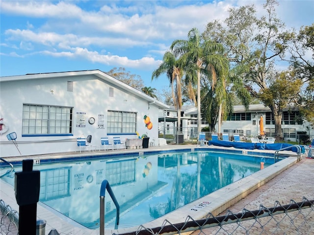 pool featuring fence