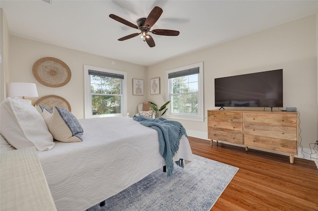 bedroom featuring hardwood / wood-style flooring and ceiling fan