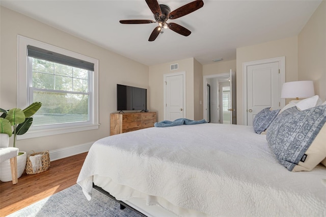 bedroom with hardwood / wood-style flooring and ceiling fan