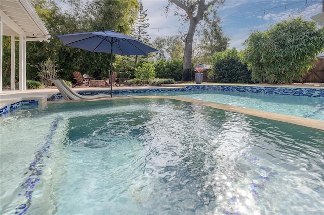 view of pool with a water slide