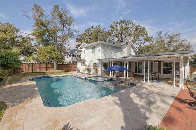 view of swimming pool featuring a patio and ceiling fan