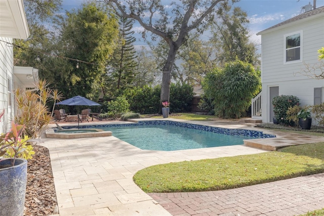 view of swimming pool featuring a patio