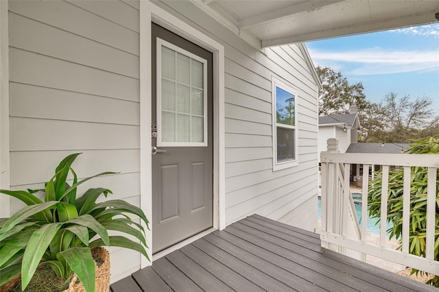 property entrance featuring a pool side deck