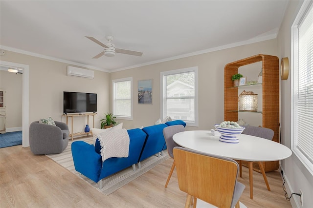 living room with ornamental molding, a wall mounted AC, and light wood-type flooring