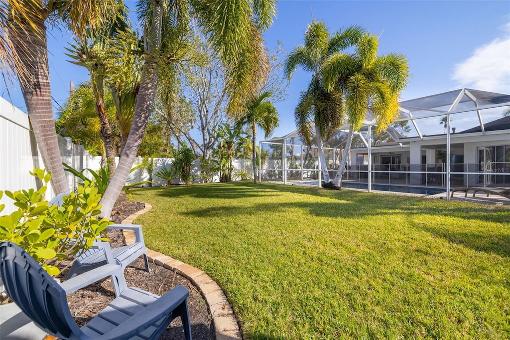 view of yard featuring a lanai