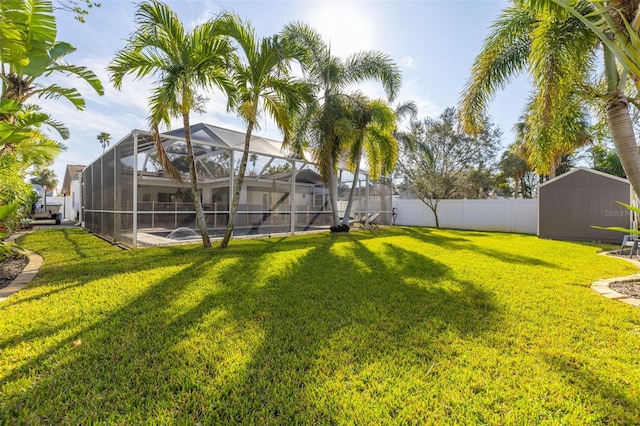 view of yard featuring glass enclosure