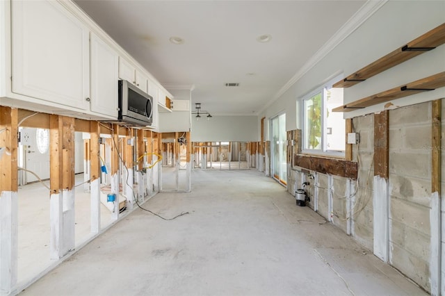 interior space with crown molding