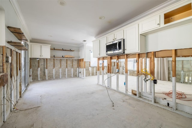 interior space with crown molding