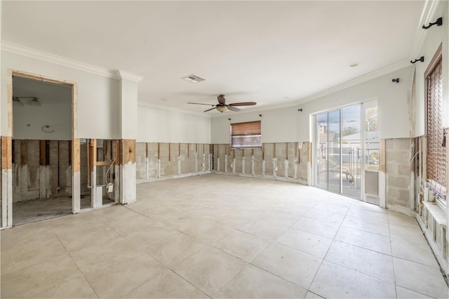 empty room with ornamental molding and ceiling fan