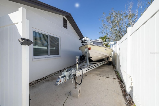 view of property exterior with a patio area