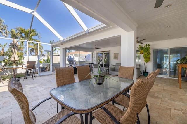 view of patio / terrace with a lanai and ceiling fan