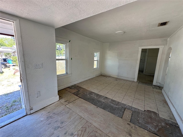 entryway featuring a textured ceiling