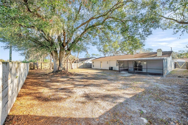 view of yard with a sunroom