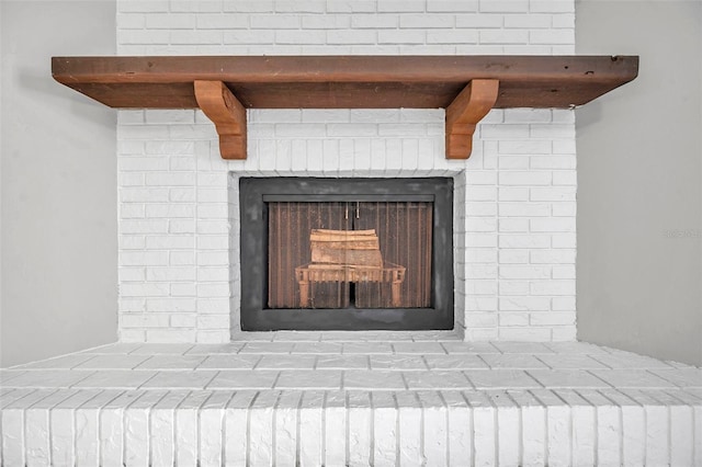 details featuring a brick fireplace