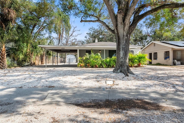 view of front of home featuring a carport