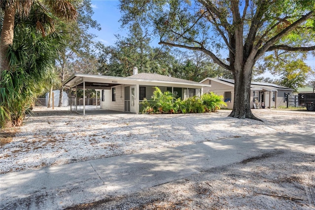 view of front of home with a carport