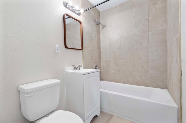 full bathroom featuring vanity, toilet, and tiled shower / bath combo