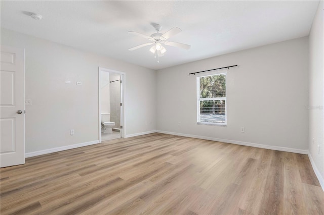 unfurnished room featuring ceiling fan and light hardwood / wood-style floors