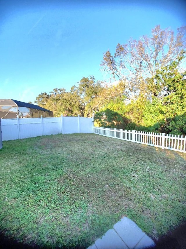 view of yard with a fenced backyard