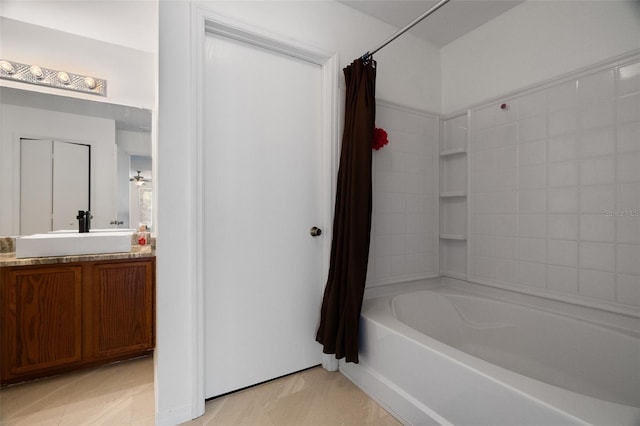 bathroom with vanity and shower / bath combo