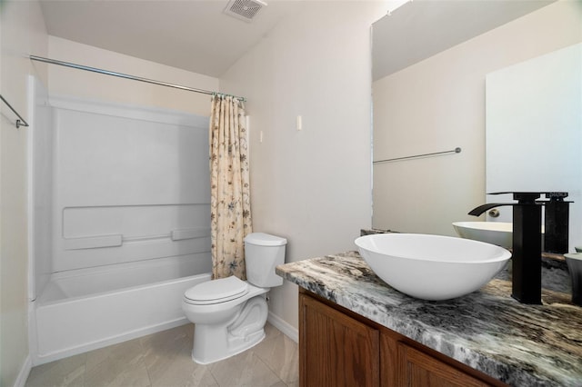 full bathroom featuring vanity, tile patterned floors, toilet, and shower / tub combo with curtain