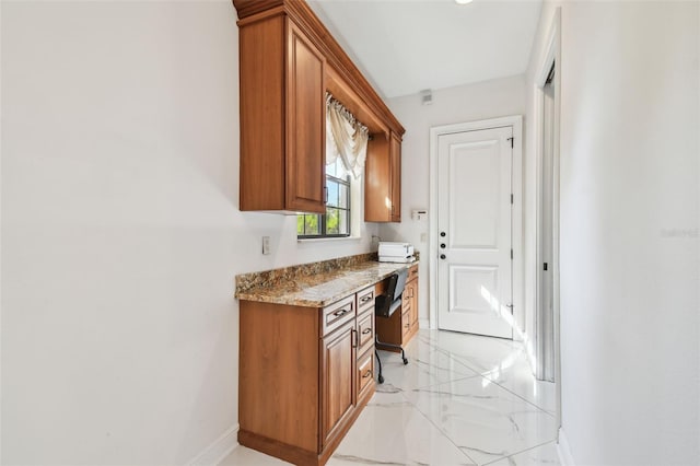 kitchen featuring light stone countertops