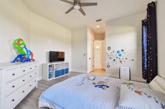 bedroom featuring hardwood / wood-style floors and ceiling fan