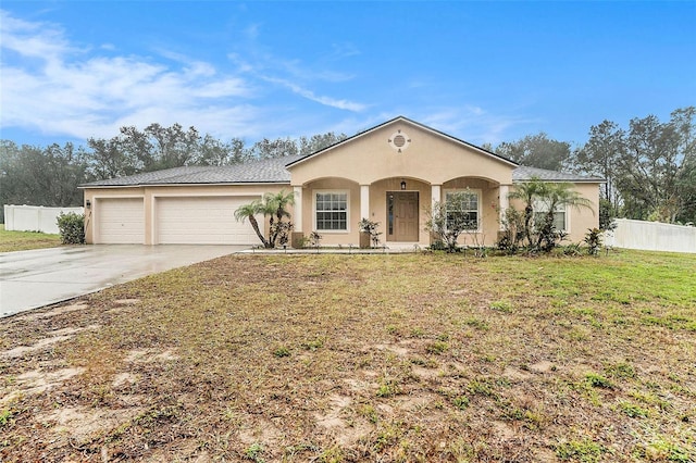 view of front facade with a garage and a front yard