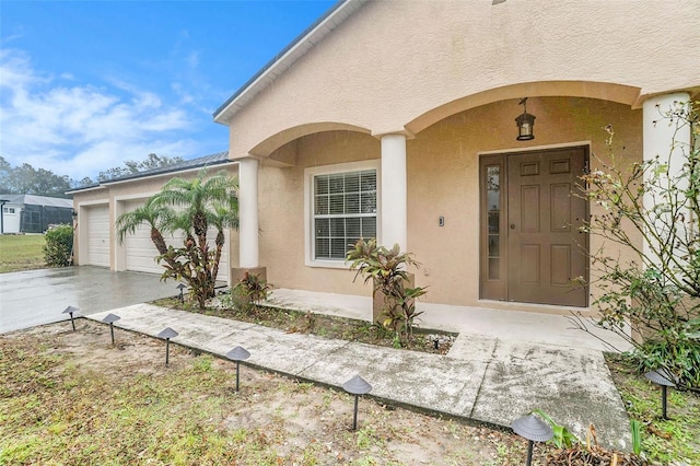 doorway to property featuring a garage