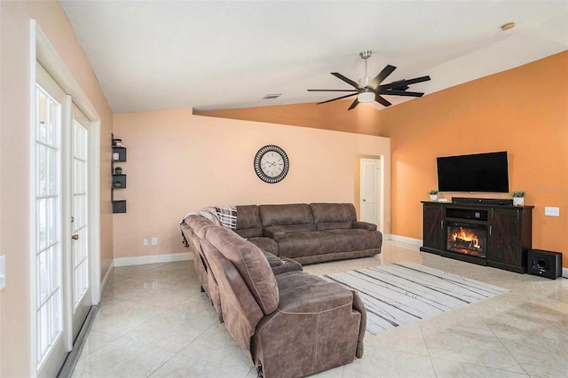 tiled living room featuring vaulted ceiling and ceiling fan