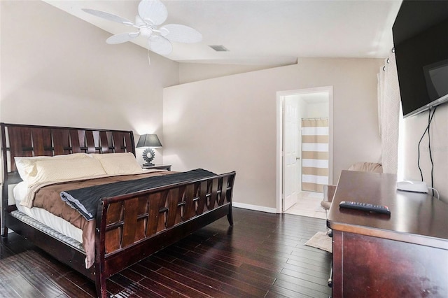 bedroom featuring hardwood / wood-style flooring, ceiling fan, lofted ceiling, and ensuite bathroom