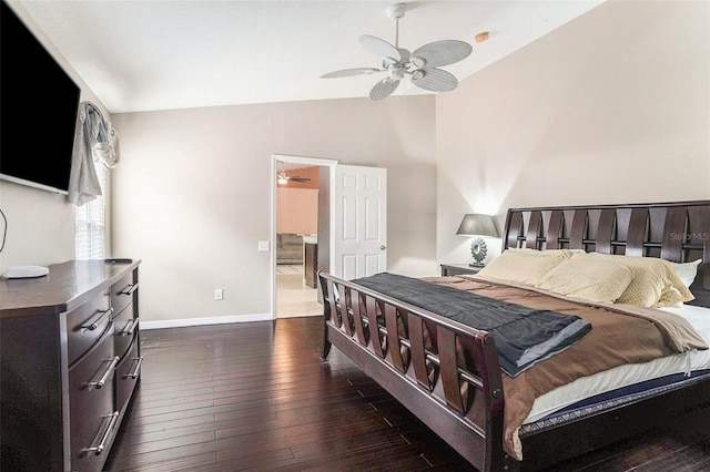 bedroom featuring lofted ceiling, dark hardwood / wood-style floors, and ceiling fan