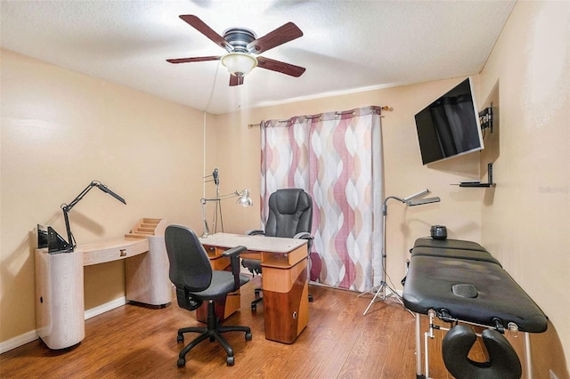 office area with hardwood / wood-style floors, a textured ceiling, and ceiling fan