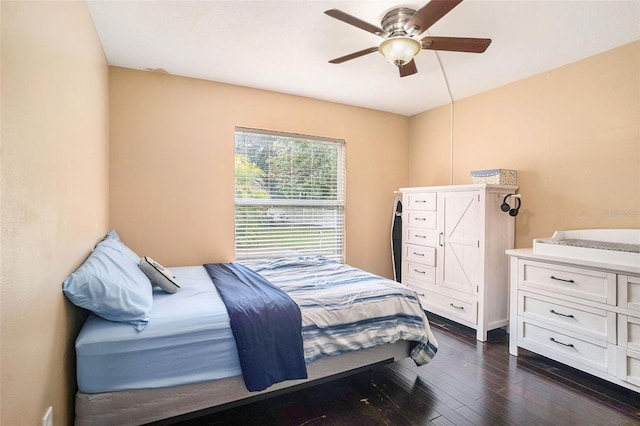 bedroom featuring ceiling fan and dark hardwood / wood-style floors