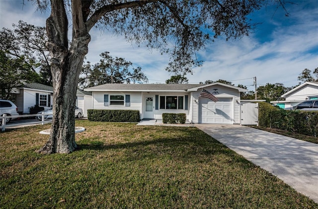 single story home featuring a garage and a front yard