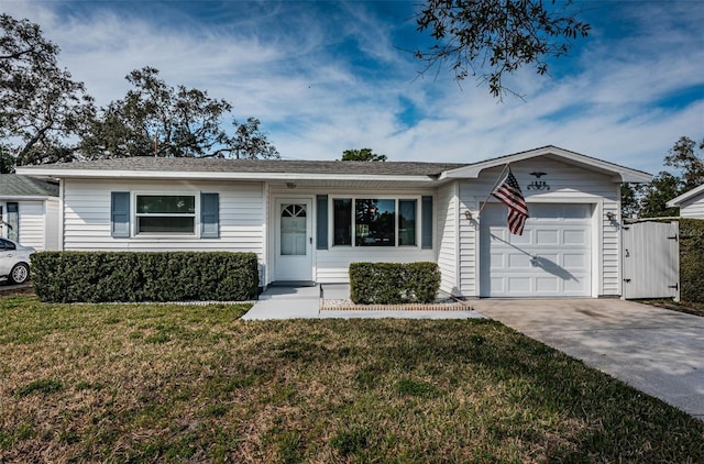 single story home featuring a garage and a front lawn