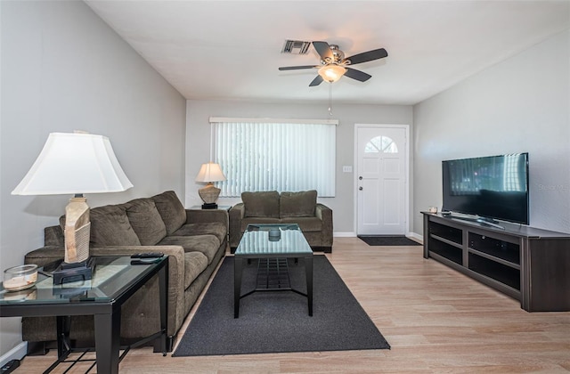 living room featuring ceiling fan and light wood-type flooring