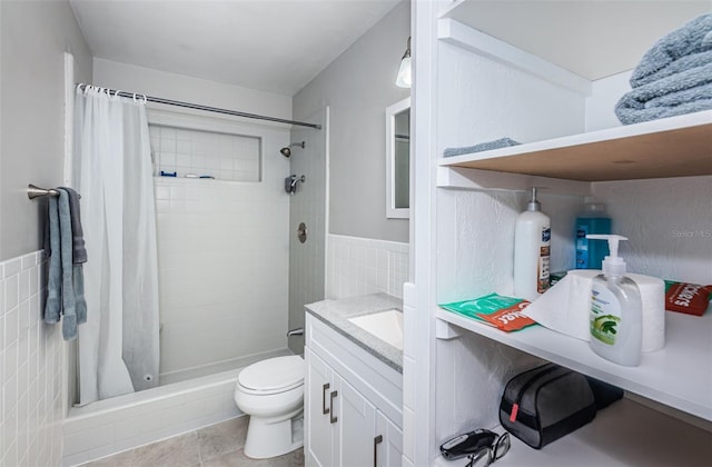 bathroom with vanity, tile walls, a shower with shower curtain, and toilet