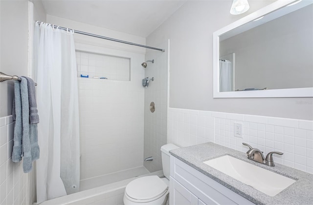 bathroom featuring tile walls, vanity, curtained shower, and toilet