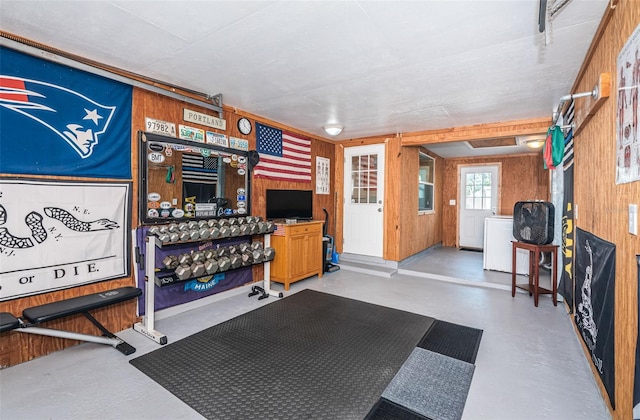 workout area featuring wooden walls