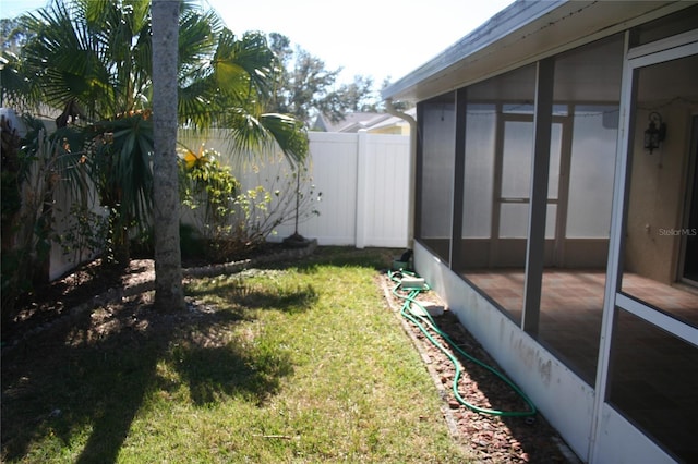 view of yard featuring a sunroom