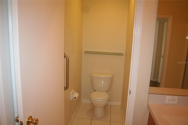 bathroom with tile patterned floors and toilet