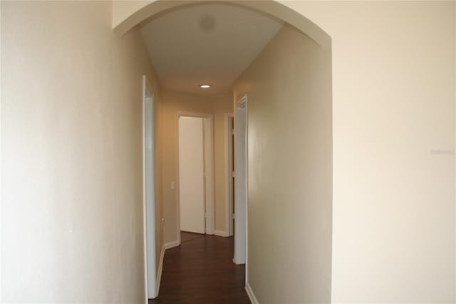 hall with dark hardwood / wood-style floors