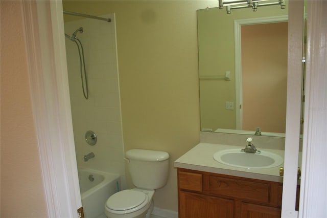 full bathroom with tiled shower / bath combo, vanity, and toilet