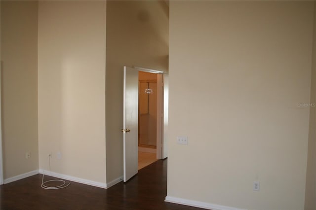 unfurnished room featuring dark hardwood / wood-style floors