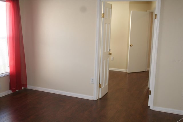 hall with dark wood-type flooring