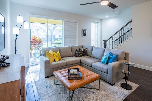 living room with hardwood / wood-style floors and ceiling fan