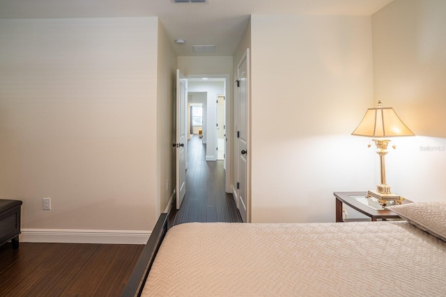 unfurnished bedroom featuring dark hardwood / wood-style flooring