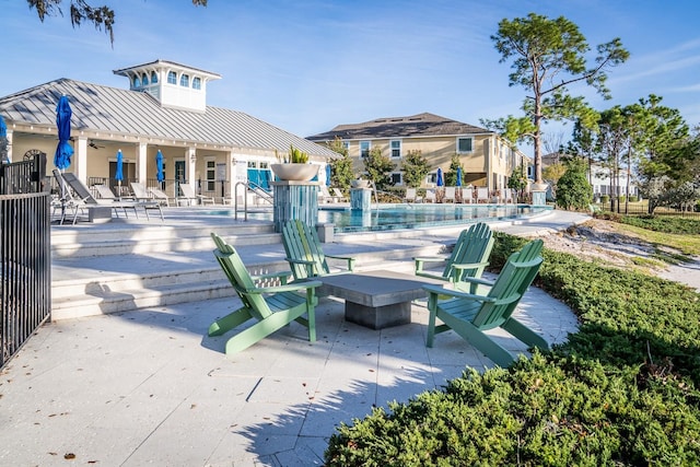 view of patio with a community pool