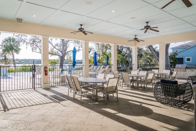 view of patio with grilling area and ceiling fan